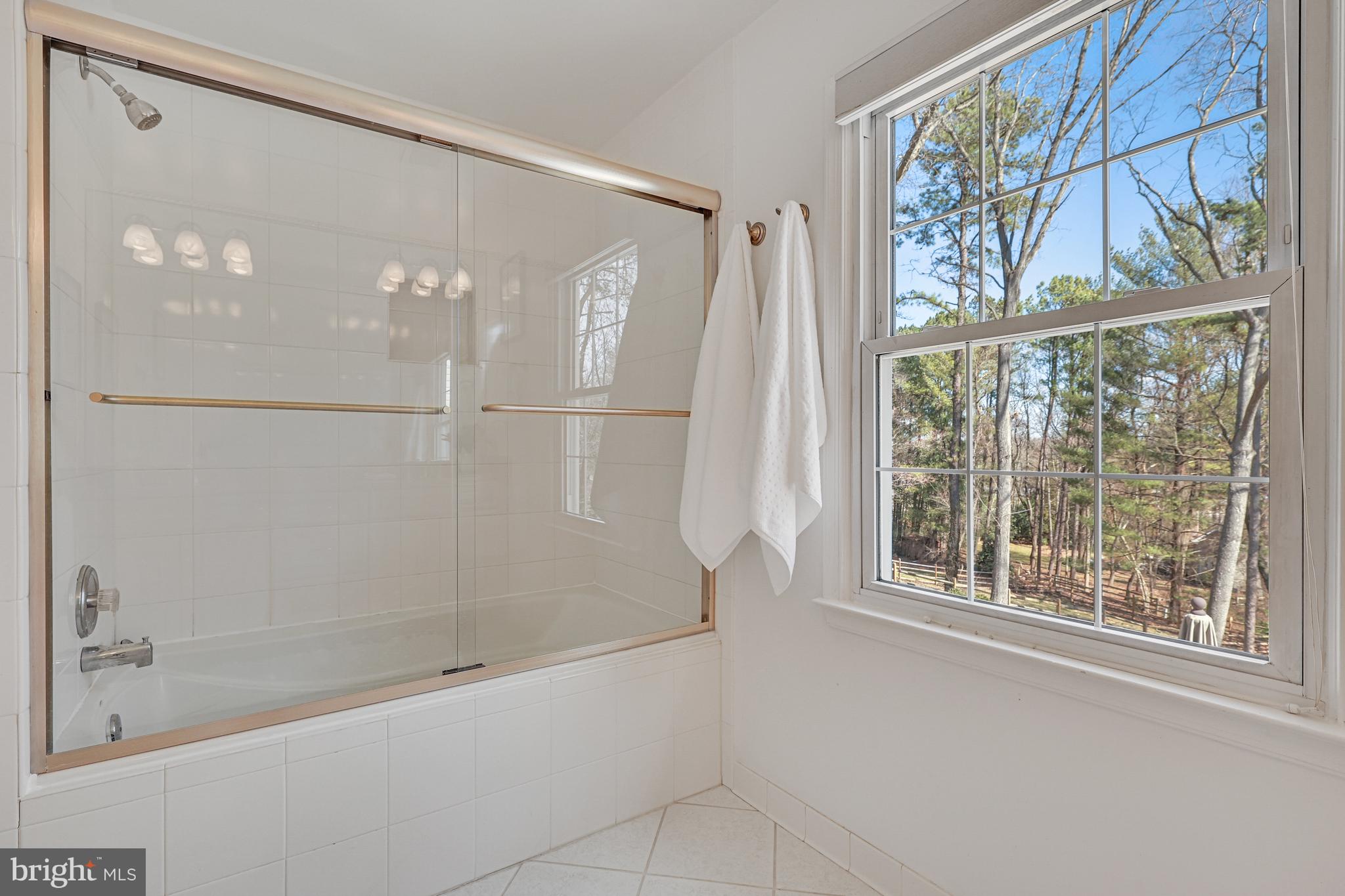 1807 Post Oak Trail Reston, VA 20191 - Photo 50 of 79 Full bath #2 has a shower/tub with ceramic tile.