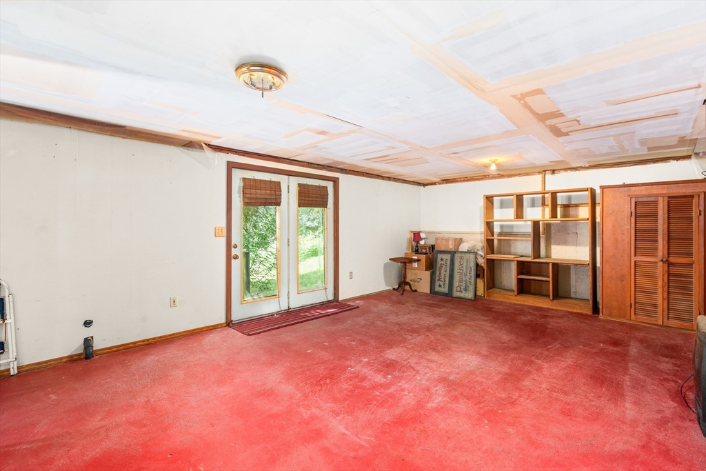 465 Doe Valley Road Athol, MA 01331 - Photo 20 of 36 a view of an empty room with windows