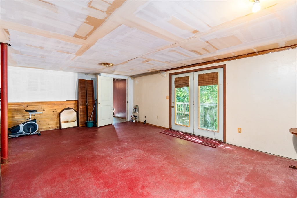 465 Doe Valley Road Athol, MA 01331 - Photo 21 of 36 a view of a room with gym equipment and a large window