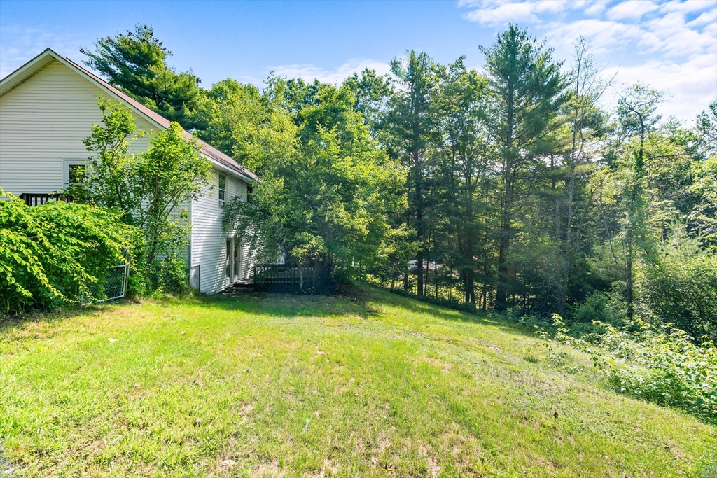 465 Doe Valley Road Athol, MA 01331 - Photo 32 of 36 a view of a back yard from a patio