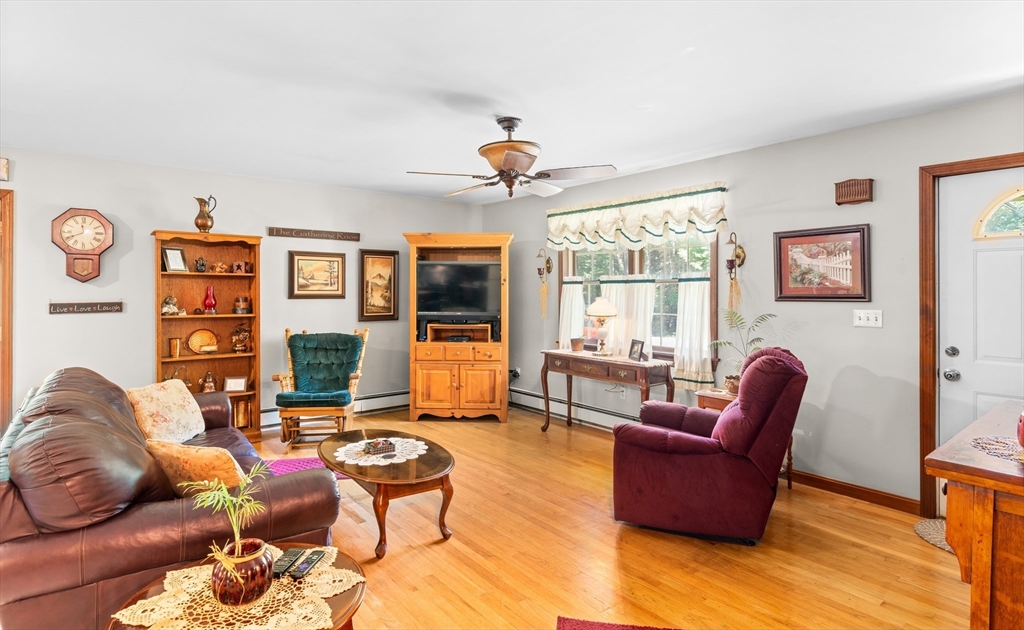 465 Doe Valley Road Athol, MA 01331 - Photo 6 of 36 a living room with furniture a rug and a flat screen tv