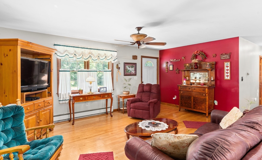 465 Doe Valley Road Athol, MA 01331 - Photo 8 of 36 a living room with furniture and a flat screen tv
