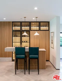 a view of a livingroom with furniture and a window