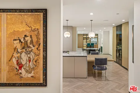 a large kitchen with a table and chairs