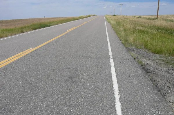 a view of a swimming pool with an outdoor space and seating area