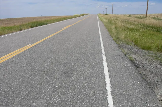 a view of a swimming pool with an outdoor space and seating area