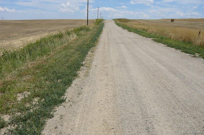 217 South Price Road Deer Trail, CO 80105 - Photo 4 of 7 a view of a road with an ocean view