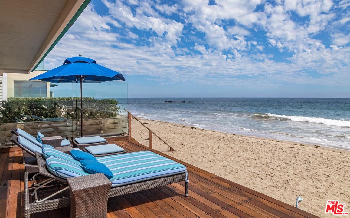 23416 Malibu Colony Road Malibu, CA 90265 - Photo 25 of 26 a view of a terrace with wooden floor and a yard