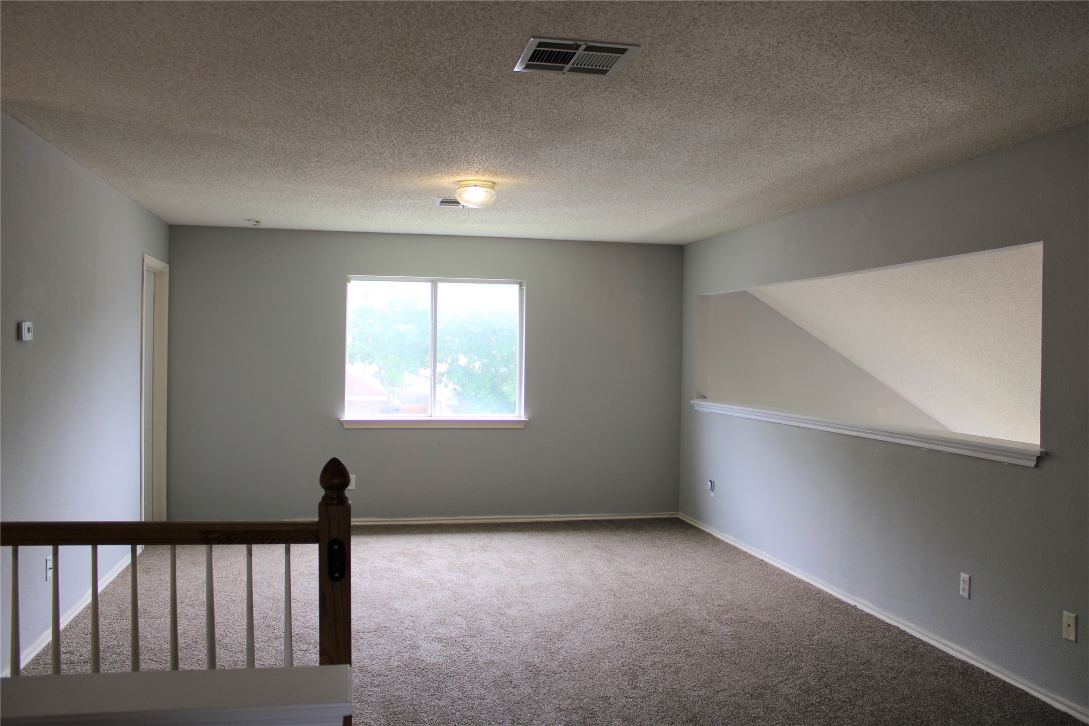 16205 Glorious Lane Pflugerville, TX 78660 - Photo 16 of 30 a view of an empty room with a window