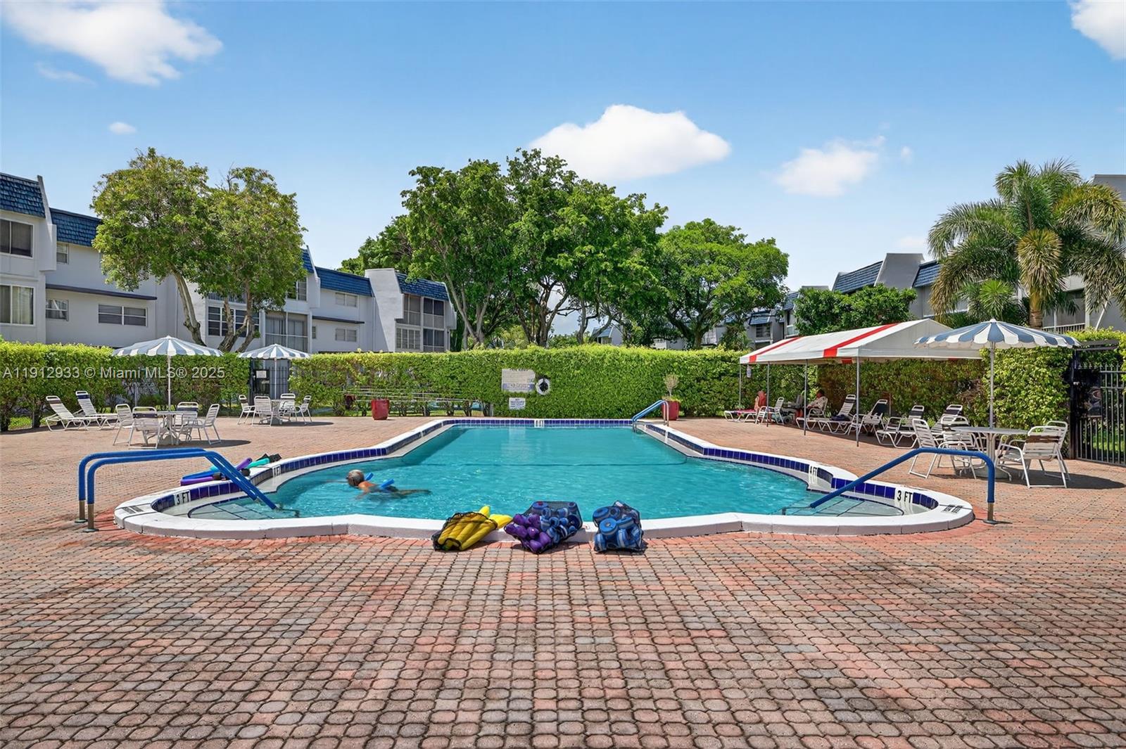 7817 Golf Cir Drive, Unit 305 Margate, FL 33063 - Photo 33 of 43 a view of a house with swimming pool outdoor seating