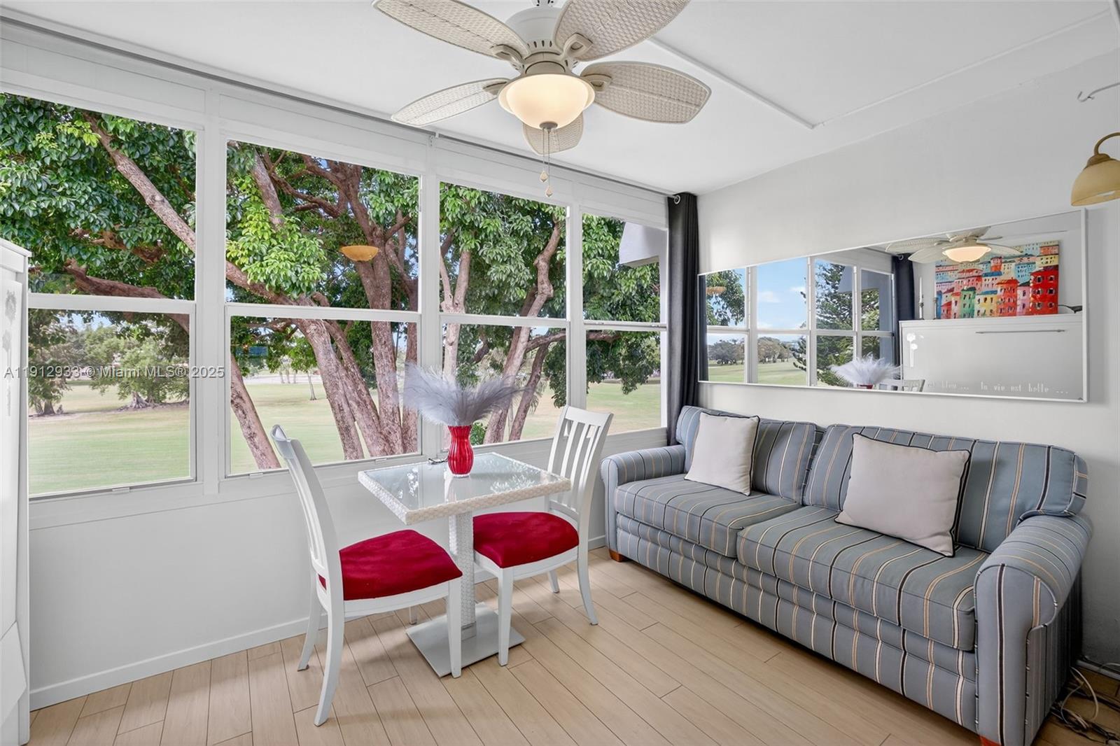 7817 Golf Cir Drive, Unit 305 Margate, FL 33063 - Photo 8 of 43 a living room with furniture and a large window