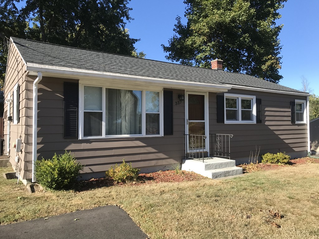 a front view of a house with a patio