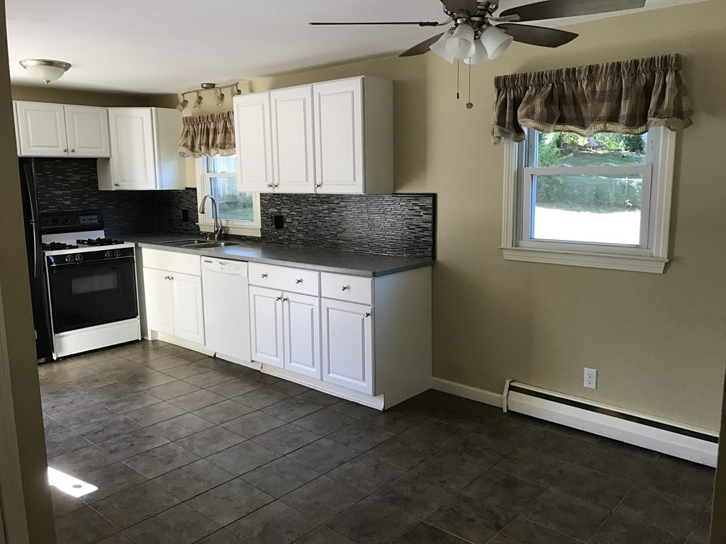 337 Westfield Road Holyoke, MA 01040 - Photo 3 of 13 a kitchen with a sink cabinets and window
