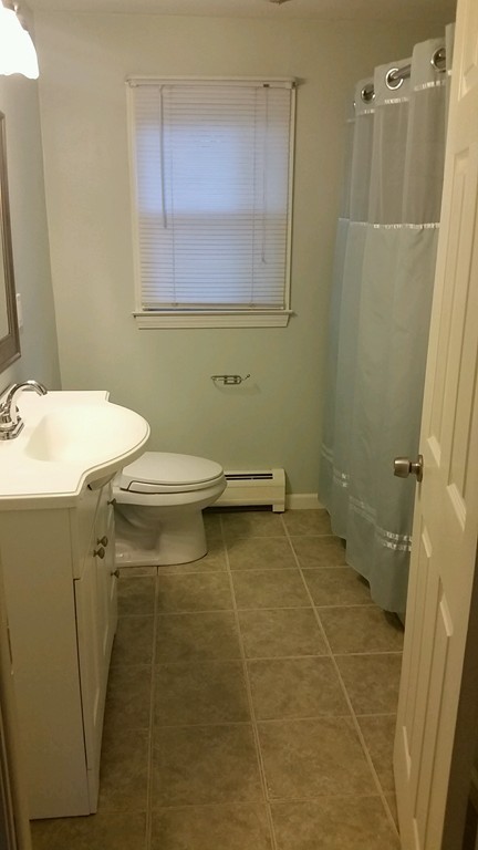 337 Westfield Road Holyoke, MA 01040 - Photo 4 of 13 a bathroom with a sink a toilet and a shower