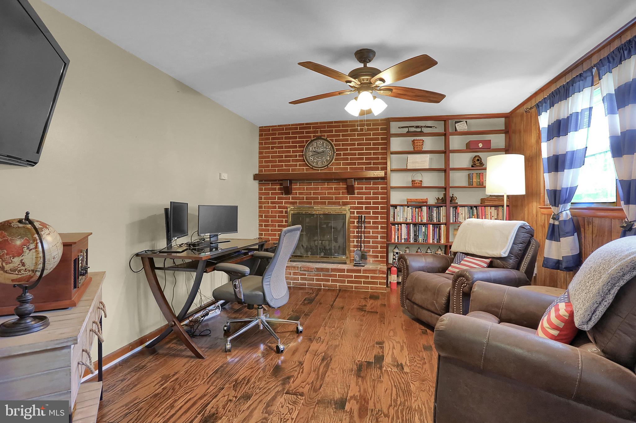 5941 Timothy Road Harrisburg, PA 17112 - Photo 6 of 35 Den with wood burning fireplace.