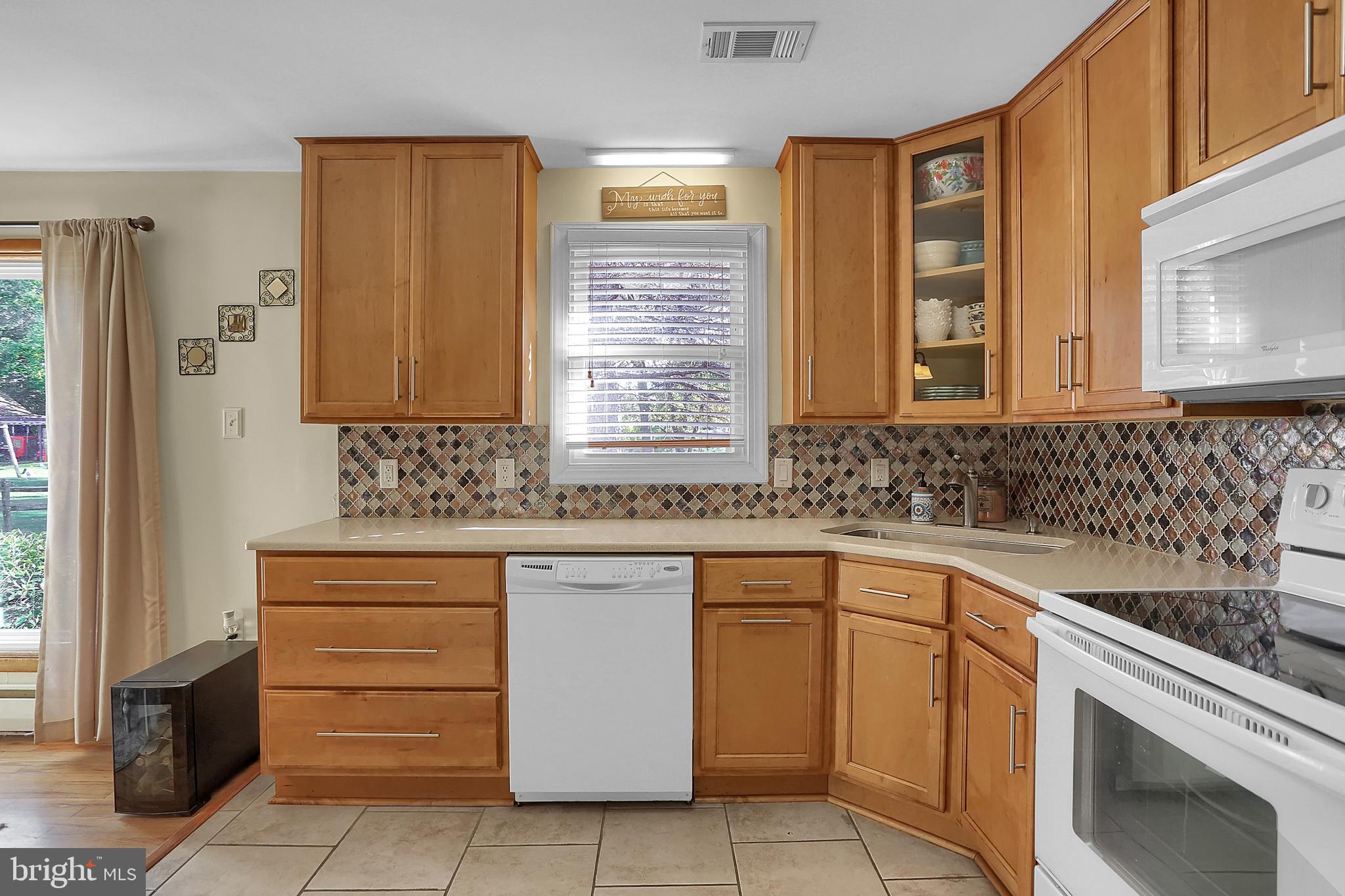 5941 Timothy Road Harrisburg, PA 17112 - Photo 10 of 35 Kitchen with tiled floor and backsplash.