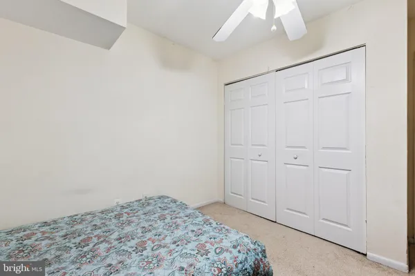 a view of washer and dryer with kitchen in the background