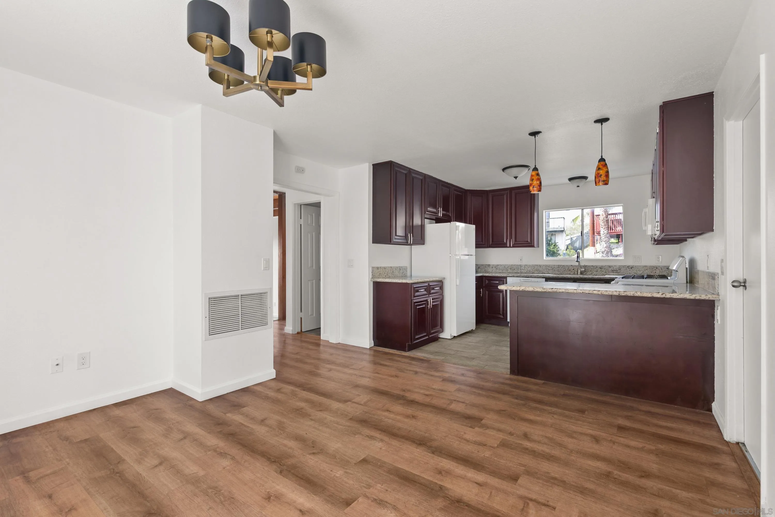 9811 Eucalyptus Street Spring Valley, CA 91977 - Photo 16 of 55 a kitchen with stainless steel appliances granite countertop a refrigerator a stove and a sink