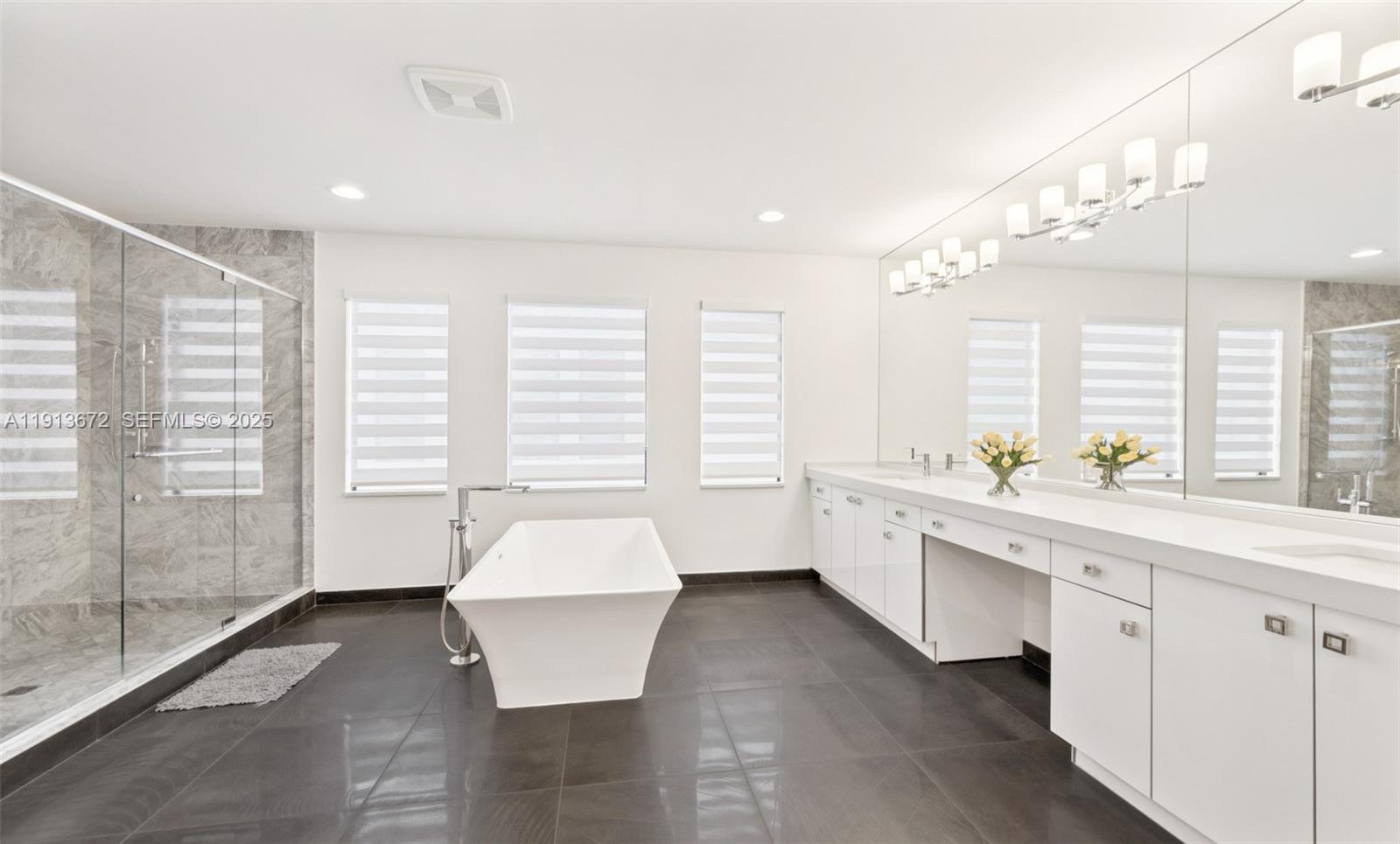 17182 Windy Pointe Lane Boca Raton, FL 33496 - Photo 11 of 13 a large white kitchen with a large window