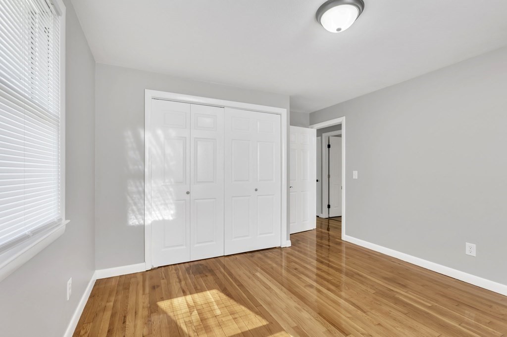 172 Garvey Drive Springfield, MA 01109 - Photo 14 of 28 a view of room with window and wooden floor