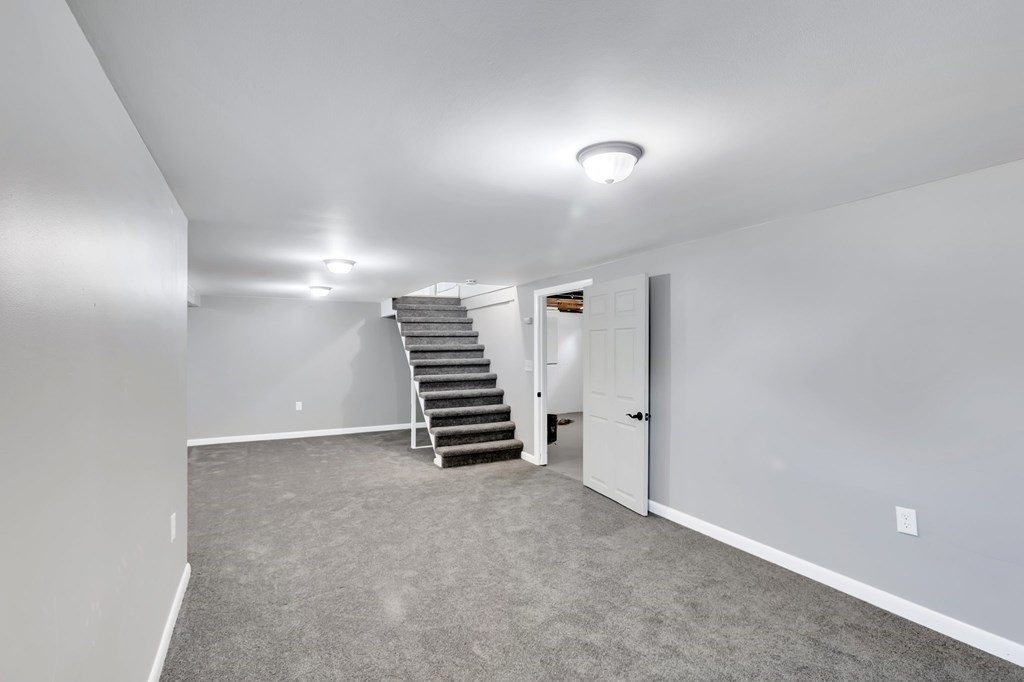 172 Garvey Drive Springfield, MA 01109 - Photo 19 of 28 a view of room with stairs and a window