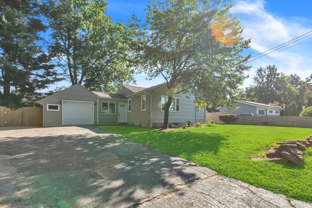 172 Garvey Drive Springfield, MA 01109 - Photo 24 of 28 a front view of a house with yard and green space