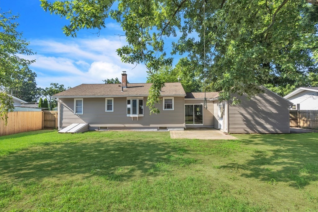 172 Garvey Drive Springfield, MA 01109 - Photo 26 of 28 a front view of a house with a garden
