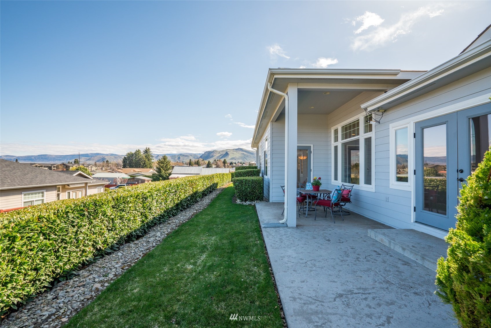 1845 Maple Street, Unit 9 Wenatchee, WA 98801 - Photo 18 of 20 a view of a house with backyard and porch