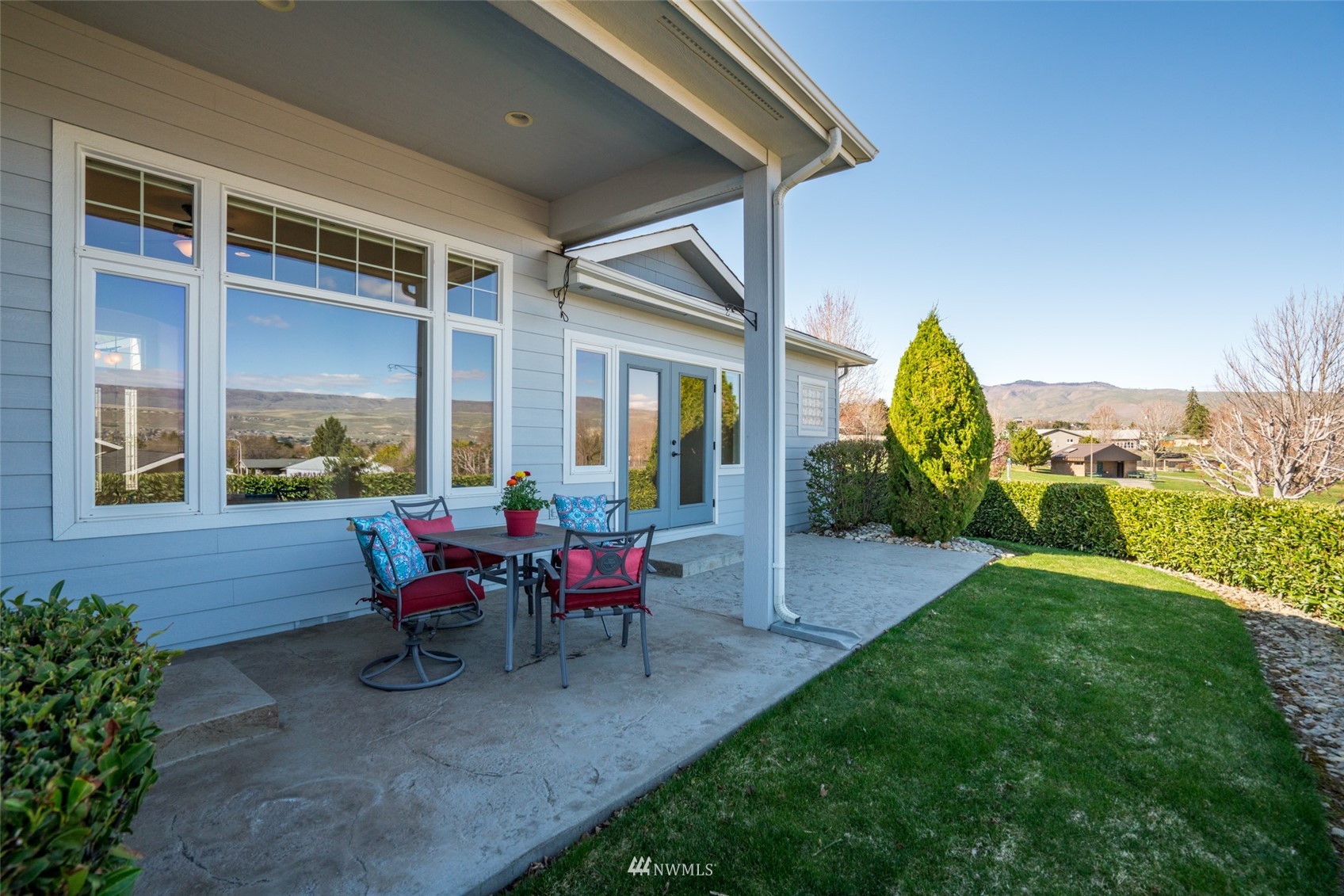 1845 Maple Street, Unit 9 Wenatchee, WA 98801 - Photo 19 of 20 a view of a house with backyard and porch