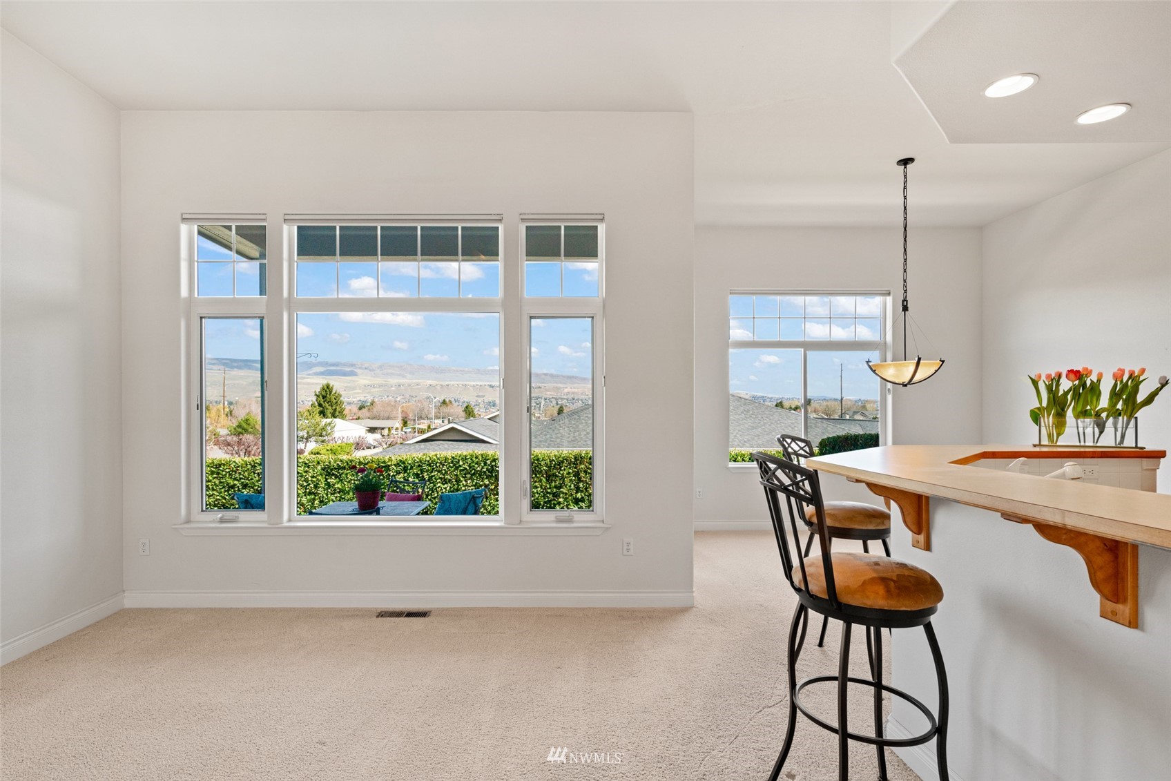 1845 Maple Street, Unit 9 Wenatchee, WA 98801 - Photo 6 of 20 a dining room with furniture and floor to ceiling window