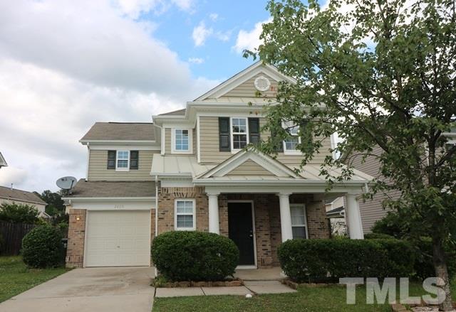 2620 Quarry Ridge Lane Raleigh, NC 27610 - Photo 1 of 25 a front view of a house with a garden