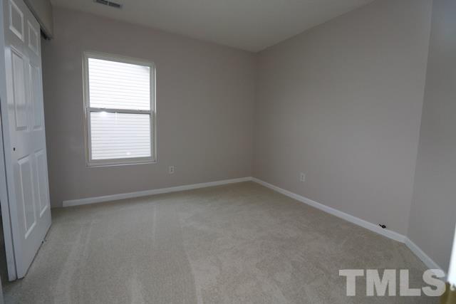 2620 Quarry Ridge Lane Raleigh, NC 27610 - Photo 11 of 25 an empty room with a window