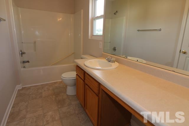 2620 Quarry Ridge Lane Raleigh, NC 27610 - Photo 13 of 25 a bathroom with a sink a toilet and shower