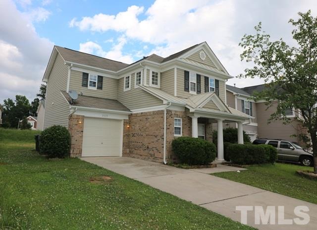 2620 Quarry Ridge Lane Raleigh, NC 27610 - Photo 24 of 25 a front view of a house with a garden