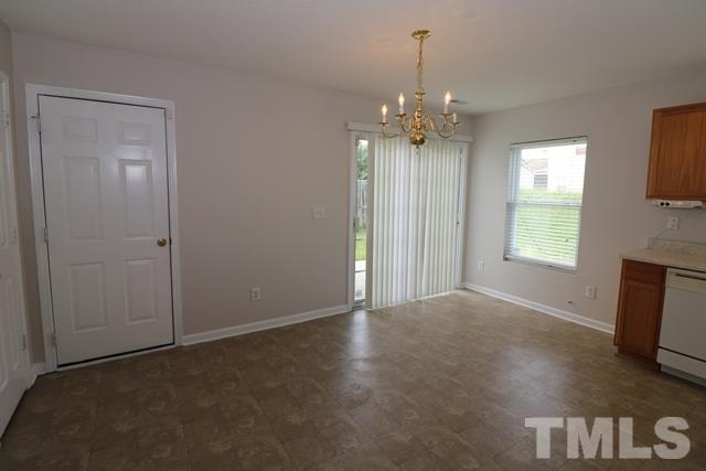 2620 Quarry Ridge Lane Raleigh, NC 27610 - Photo 8 of 25 an empty room with windows and ceiling fan