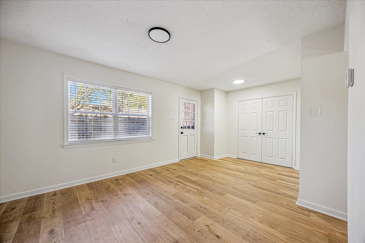 6452 Macon Road Memphis, TN 38134 - Photo 10 of 22 Entrance foyer featuring a textured ceiling and light wood finished floors