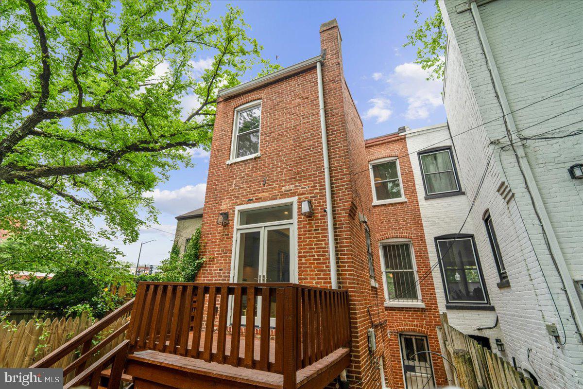 1105 G Street Southeast Washington, DC 20003 - Photo 2 of 51 Rear facade, private deck and patio.