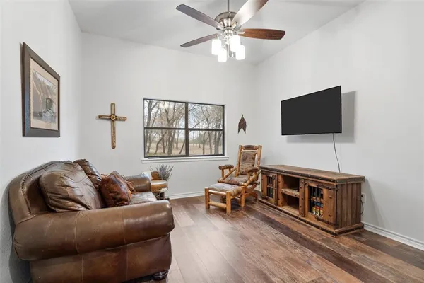 a living room with furniture and a flat screen tv