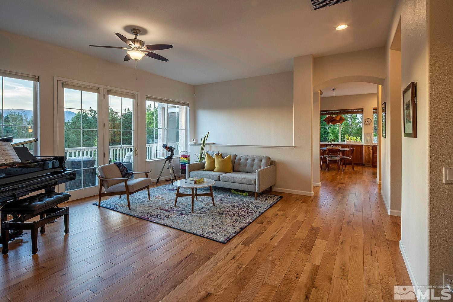 1689 Aspen Creek Road Reno, NV 89519 - Photo 11 of 40 a living room with furniture and a wooden floor