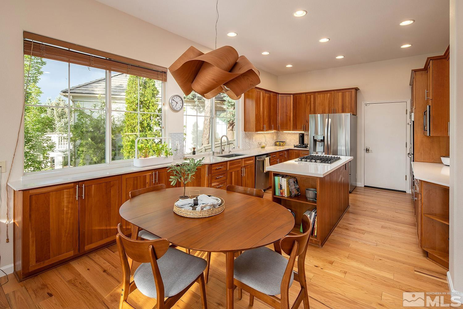 1689 Aspen Creek Road Reno, NV 89519 - Photo 27 of 40 a view of a dining room with furniture window and wooden floor