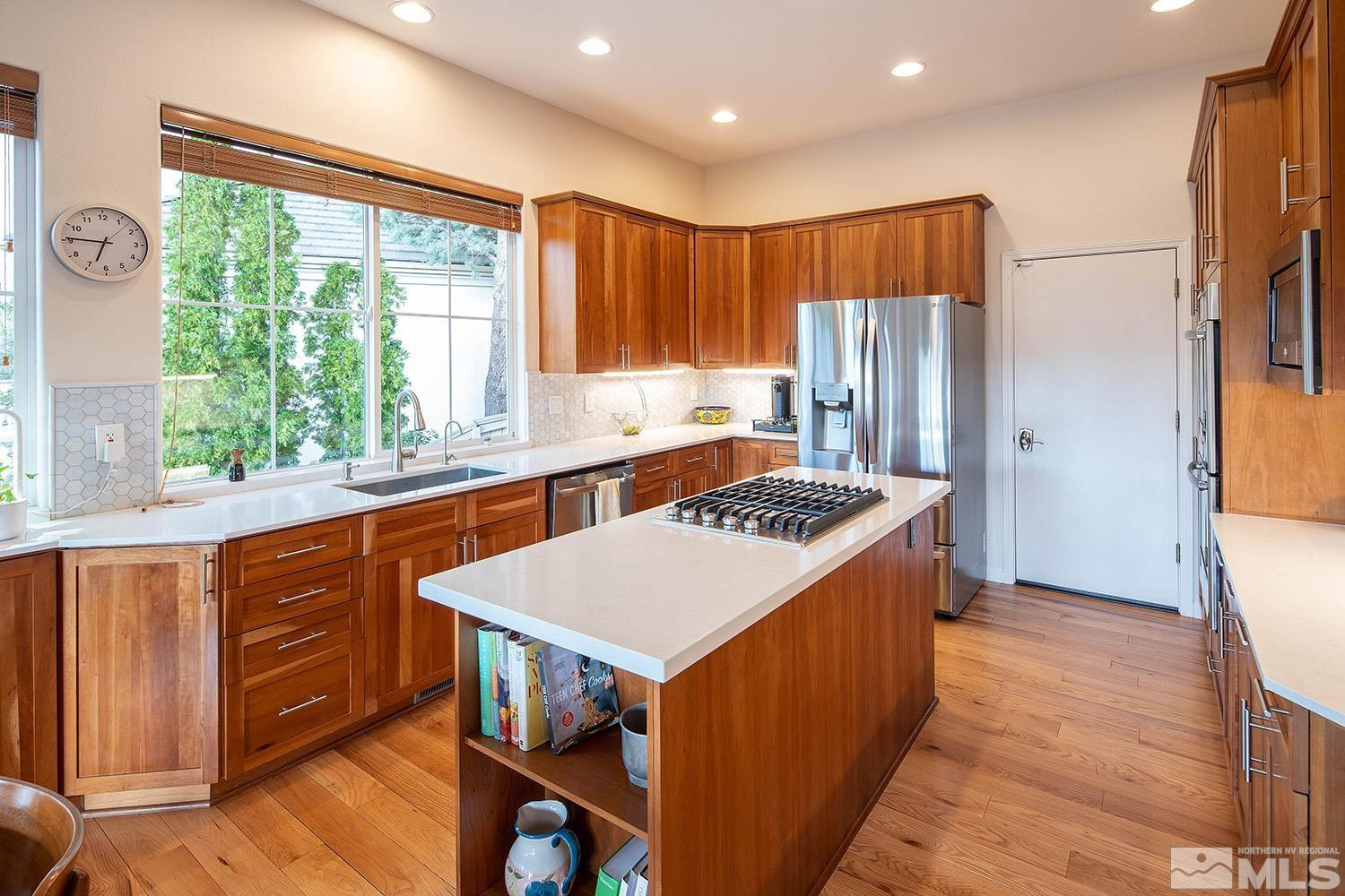 1689 Aspen Creek Road Reno, NV 89519 - Photo 5 of 40 a kitchen with a stove a refrigerator and a sink