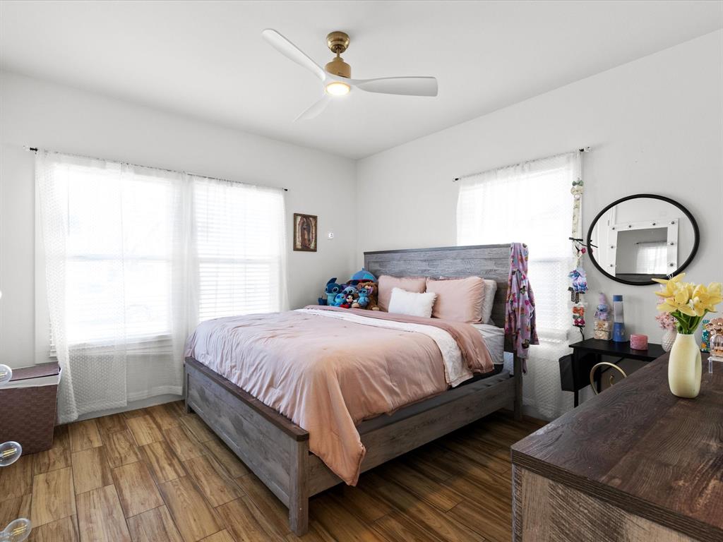 1304 East Mulkey Street Fort Worth, TX 76104 - Photo 11 of 19 a bedroom with a bed and window