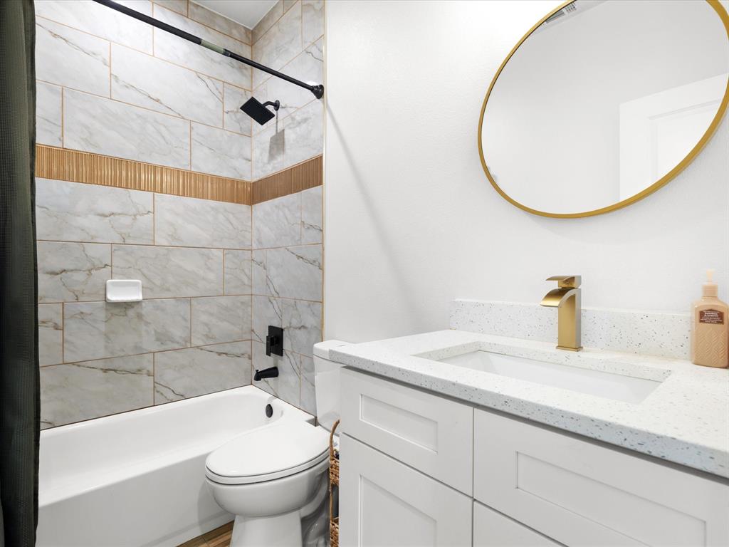 1304 East Mulkey Street Fort Worth, TX 76104 - Photo 12 of 19 a bathroom with a sink and a mirror