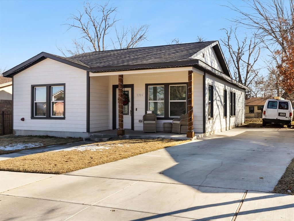1304 East Mulkey Street Fort Worth, TX 76104 - Photo 2 of 19 a view of a building with large windows