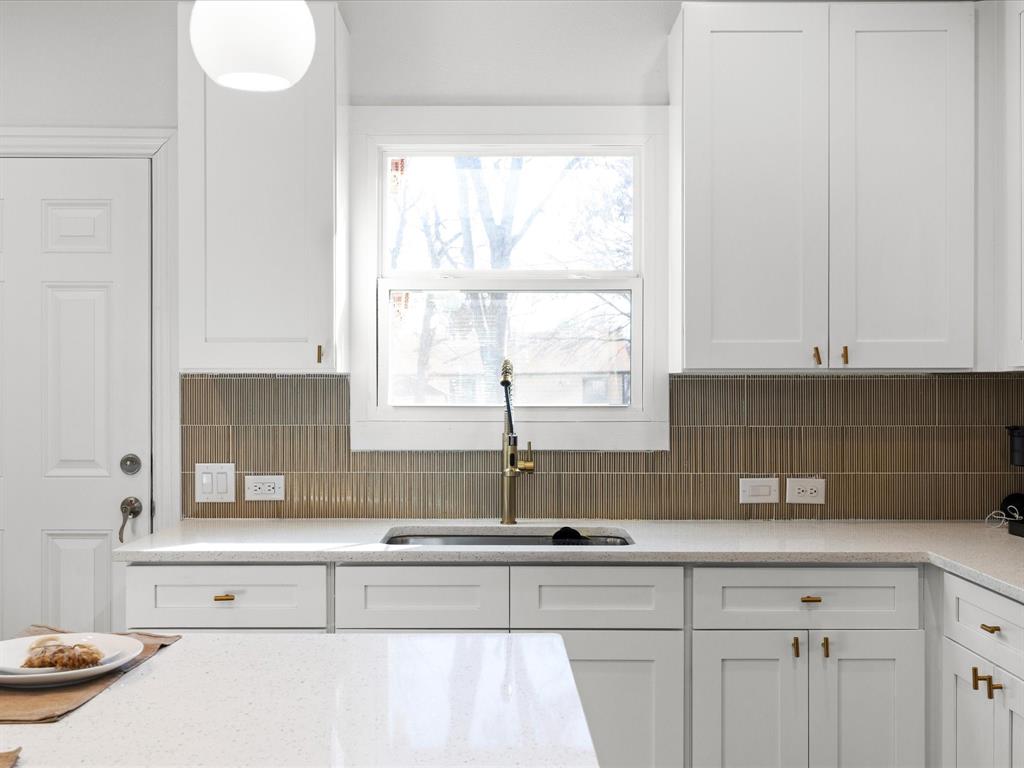 1304 East Mulkey Street Fort Worth, TX 76104 - Photo 4 of 19 a kitchen with a sink and a window