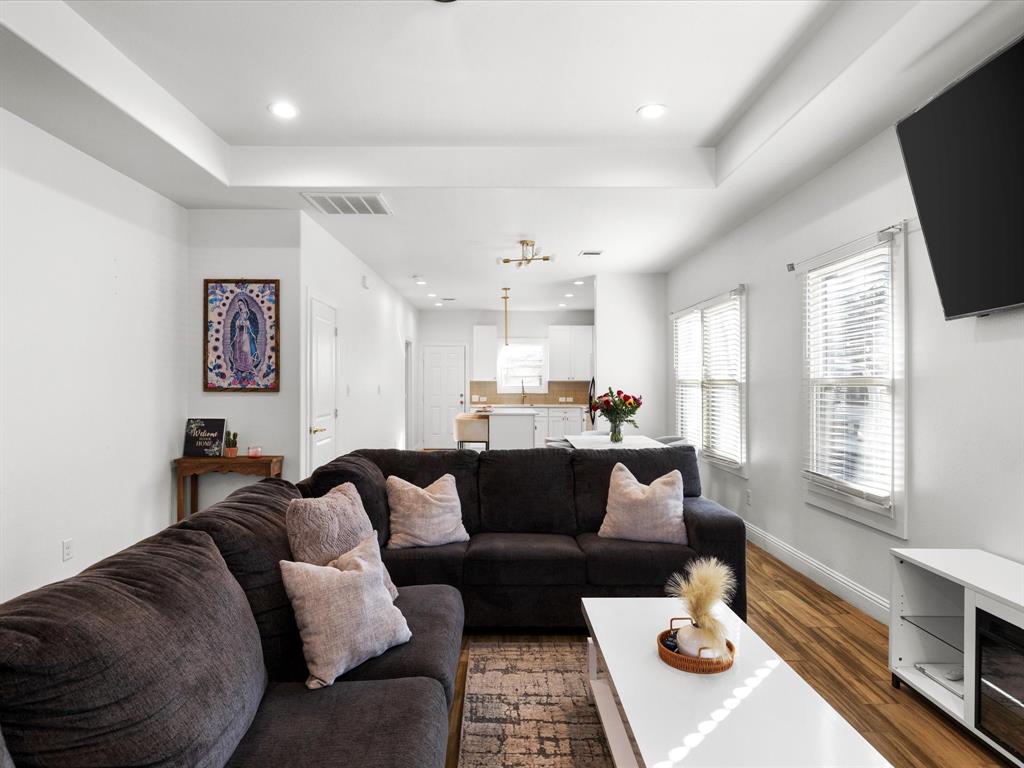 1304 East Mulkey Street Fort Worth, TX 76104 - Photo 9 of 19 a living room with furniture flat screen tv and window
