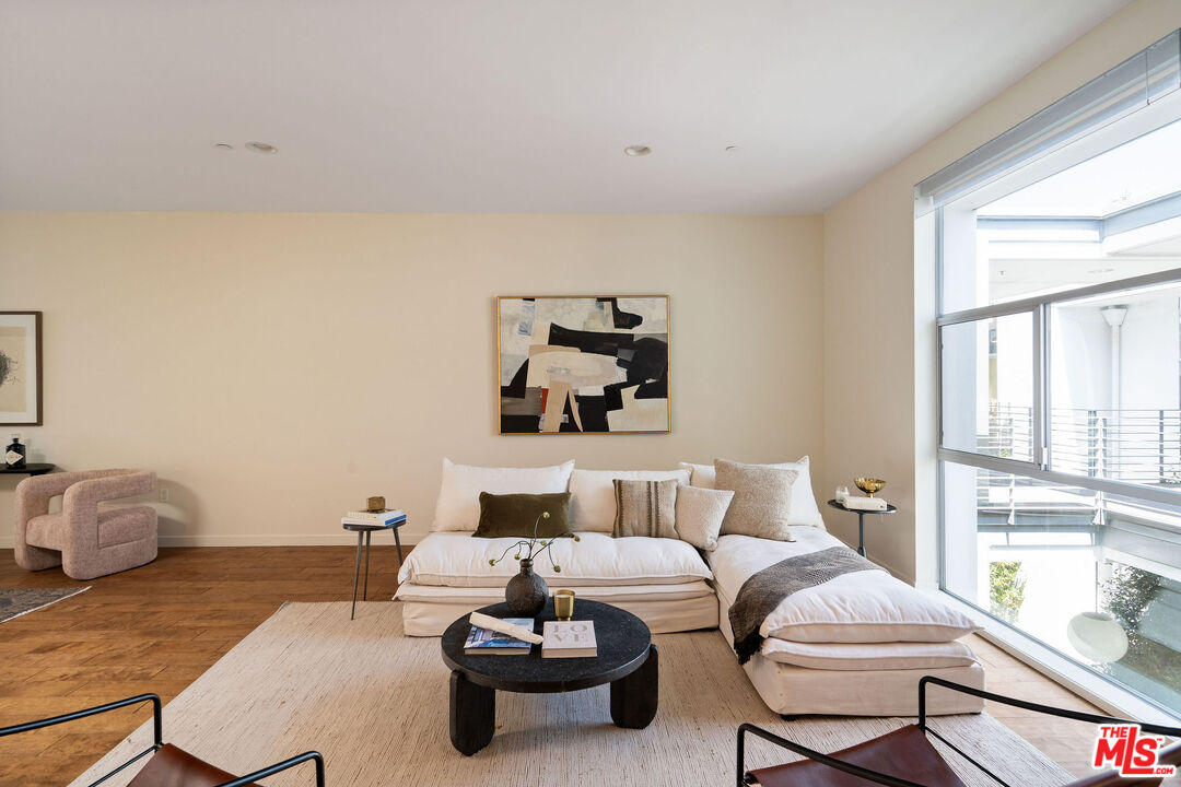 3119 Vía Dolce, Unit 302 Marina del Rey, CA 90292 - Photo 1 of 22 a living room with furniture and a window
