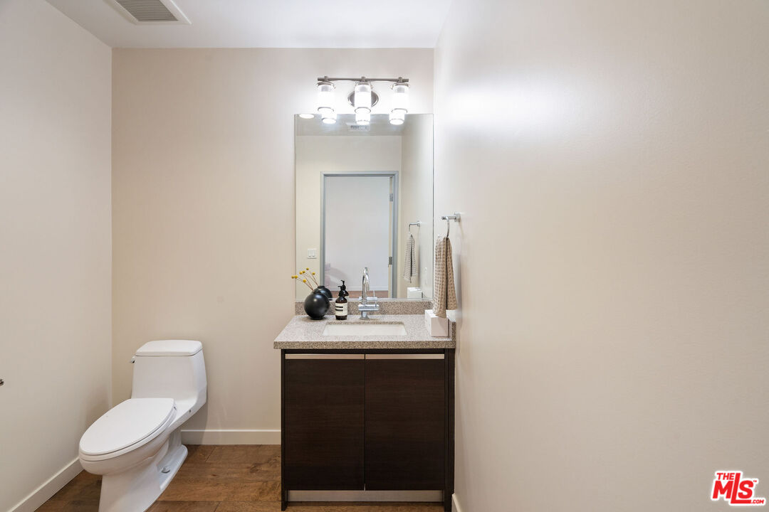 3119 Vía Dolce, Unit 302 Marina del Rey, CA 90292 - Photo 11 of 22 a bathroom with a sink vanity and toilet