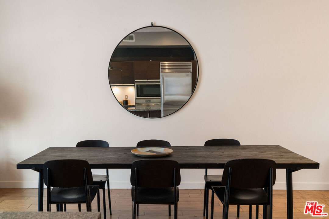3119 Vía Dolce, Unit 302 Marina del Rey, CA 90292 - Photo 15 of 22 a table and chairs in a room