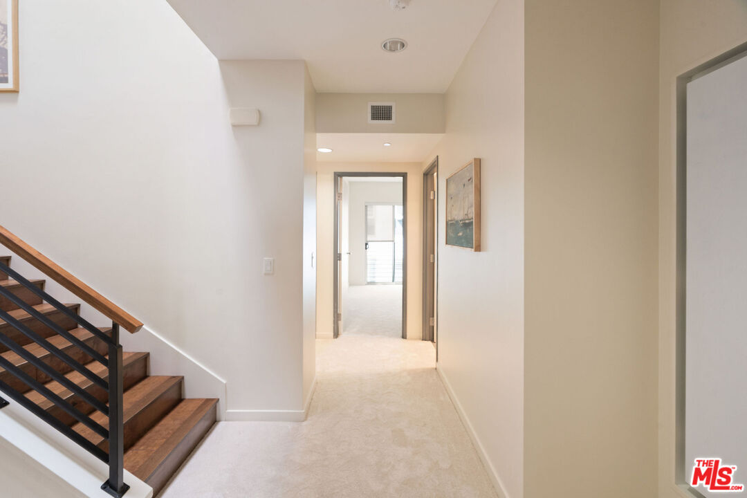 3119 Vía Dolce, Unit 302 Marina del Rey, CA 90292 - Photo 19 of 22 a view of an entryway with wooden floor